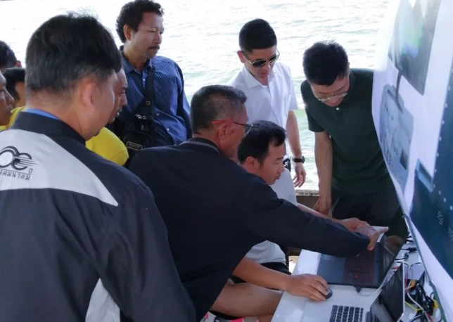 Participants viewing survey software during the Bangkok field demonstration
