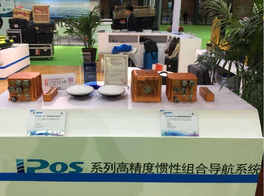 iPos integrated navigation units and GNSS antennas displayed together on the Qingdao exhibition stand in 2018
